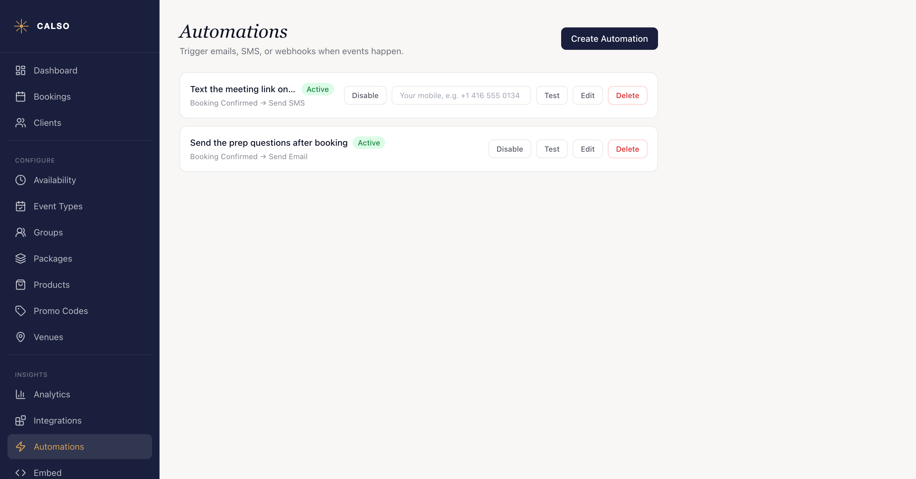 The Automations page listing two saved automations. Each carries a green Active badge, with its trigger and action reading beneath the name — Booking Confirmed to Send SMS on the first, Booking Confirmed to Send Email on the second — and Disable, Test, Edit and Delete buttons along the row. Create Automation sits at the top right.